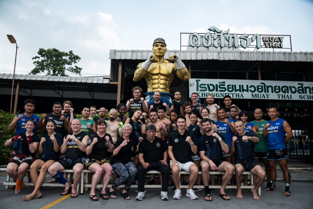 A group photo at the front of Khongsittha Muay Thai School 